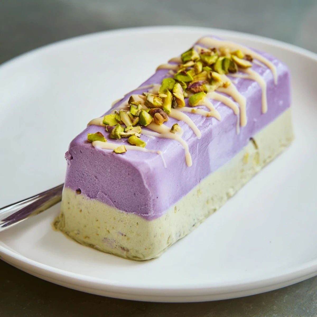 Creamy ube and pistachio ice cream bars drizzled with sweetened condensed milk.  