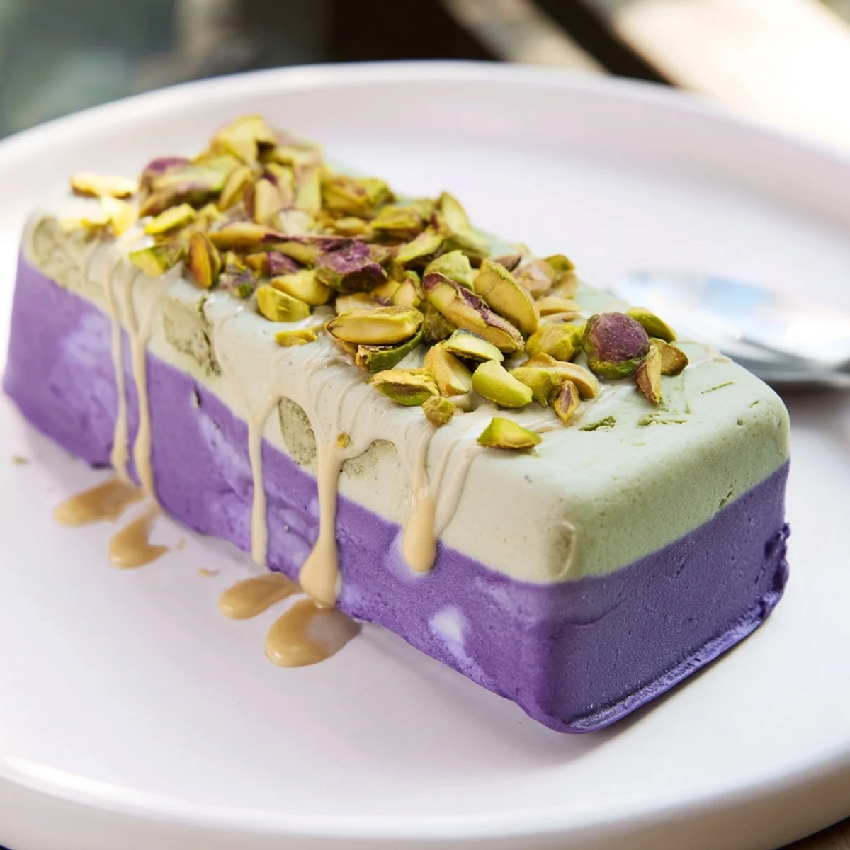Vibrant ube and nutty pistachio layered ice cream bars, perfect for summer gatherings.  