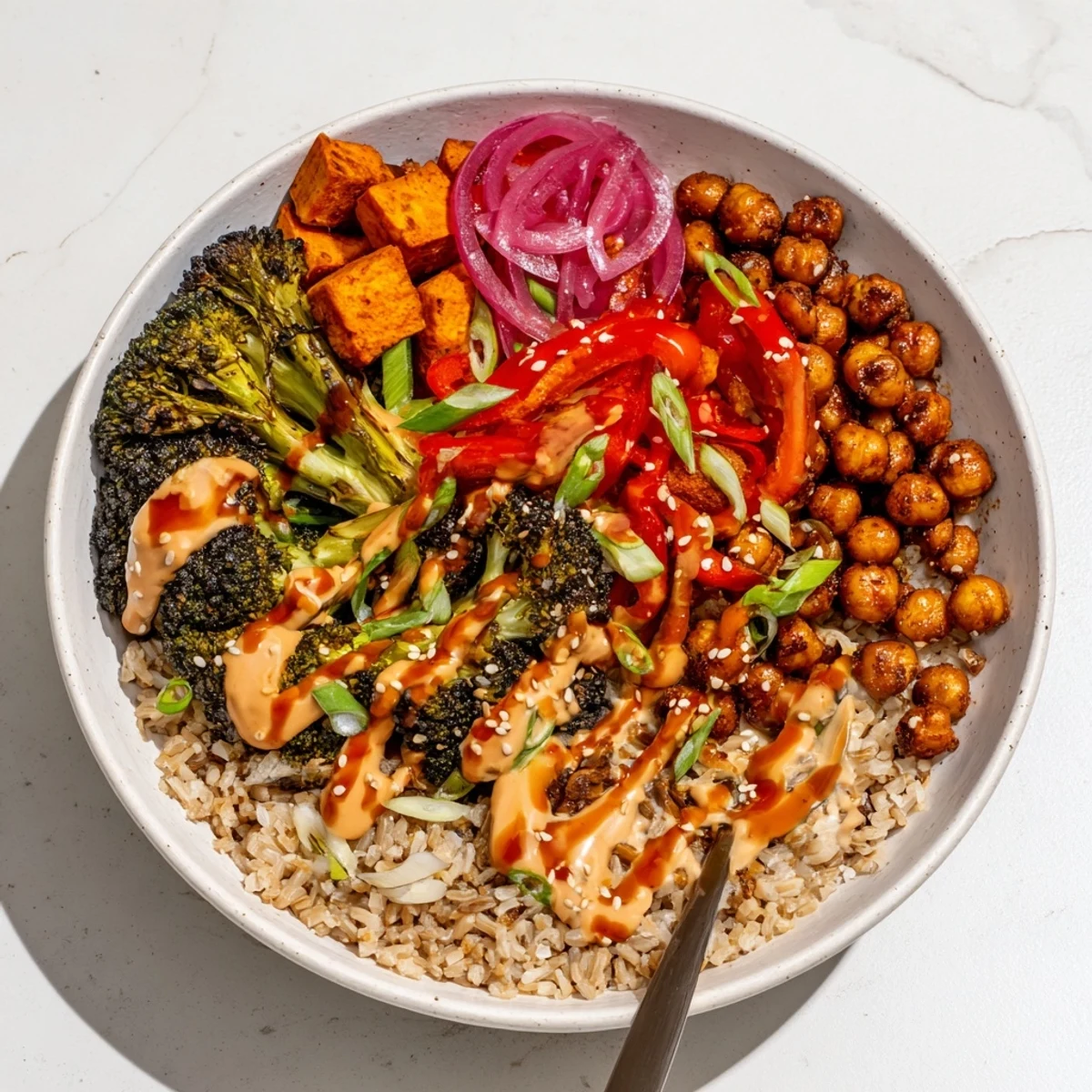 Vibrant Bold Sauce Drizzle Bowls topped with roasted veggies and zesty miso-butter.  