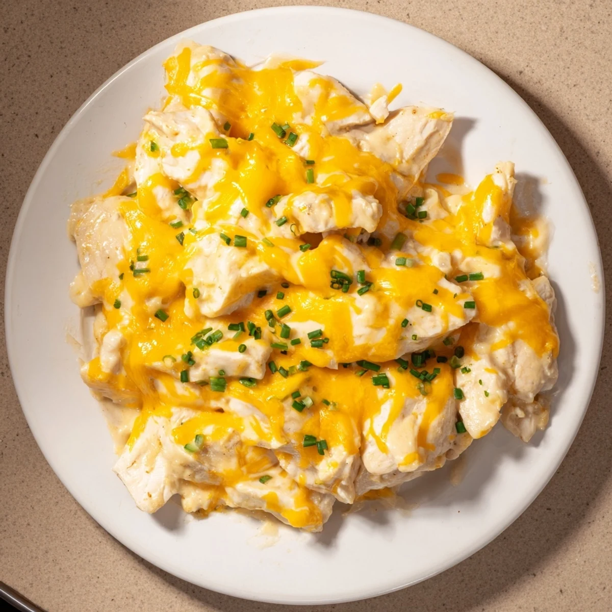 Golden, bubbly Cheddar Ranch Chicken Bake, a creamy, cheesy casserole, ready for a satisfying dinner.