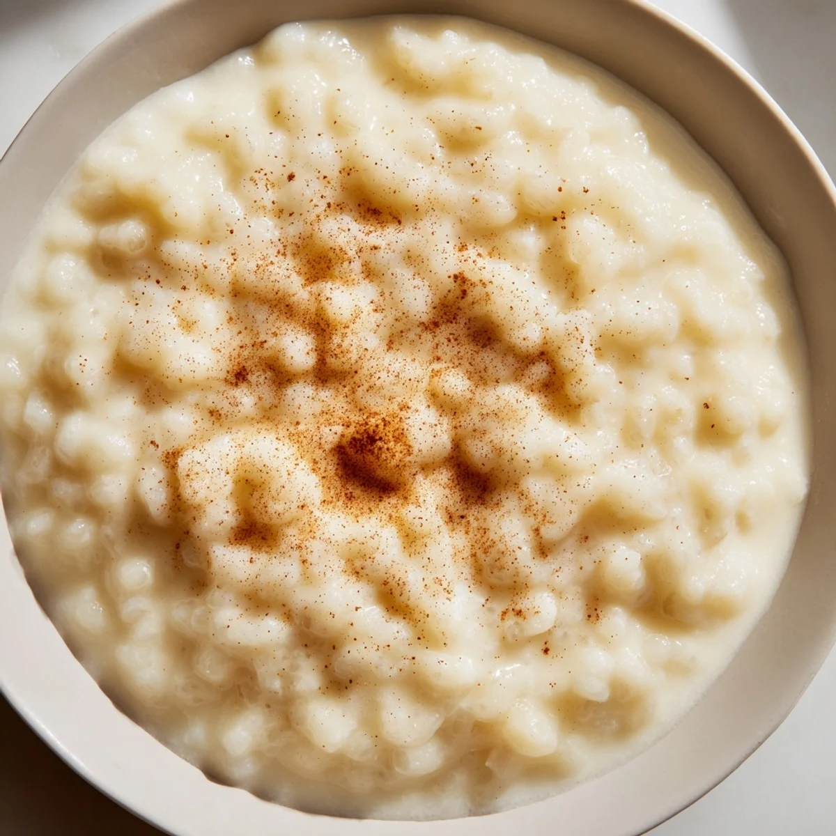 A close-up shot of creamy, homemade Rice Pudding with Leftover Rice, a comforting dessert delight.