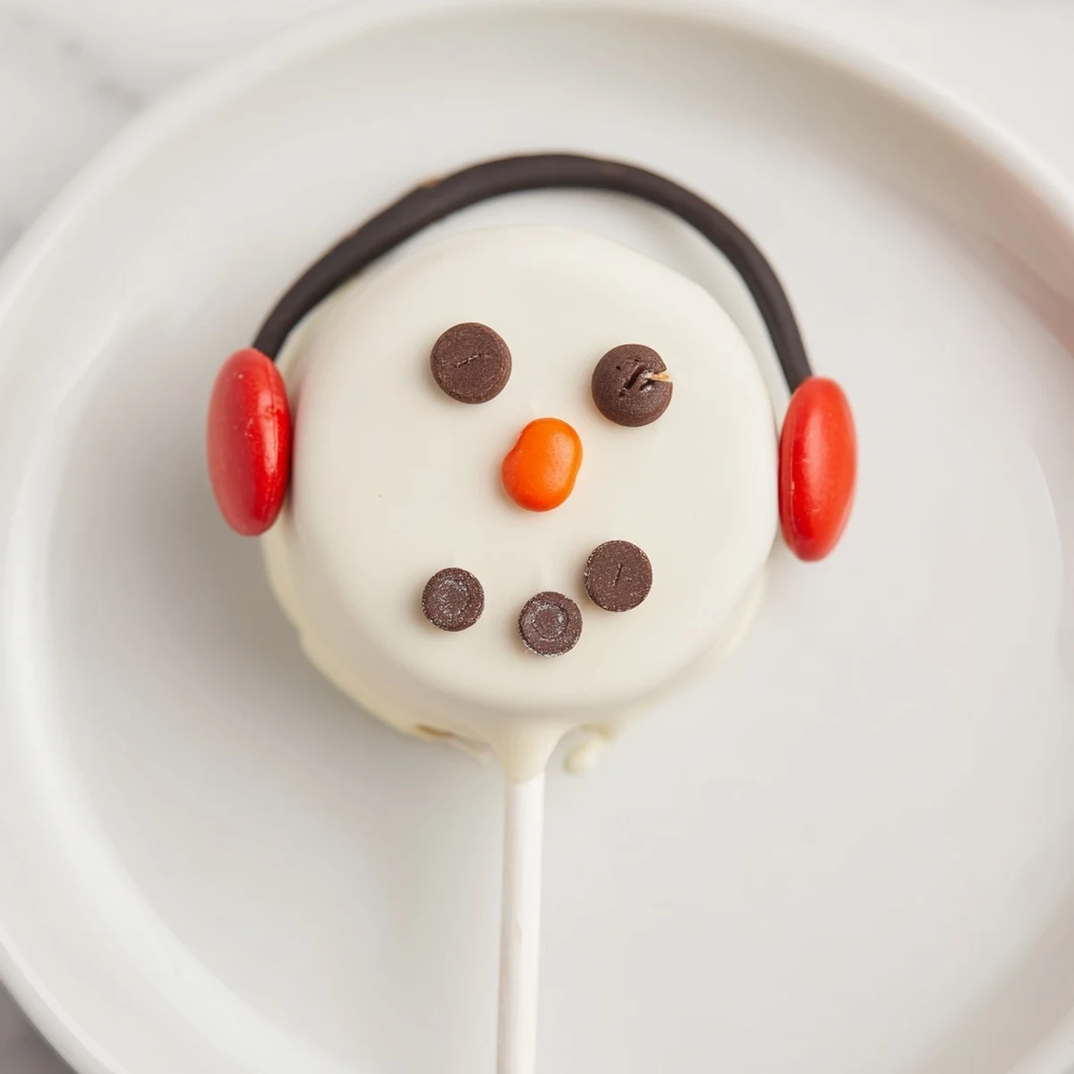 Look at these festive Budget-Friendly Oreo Snowman Pops, decorated with chocolate and sprinkles.