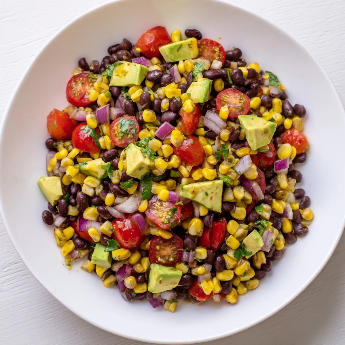 A beautiful bowl of Southwestern black bean and corn salad, perfect for a light vegetarian lunch easily.