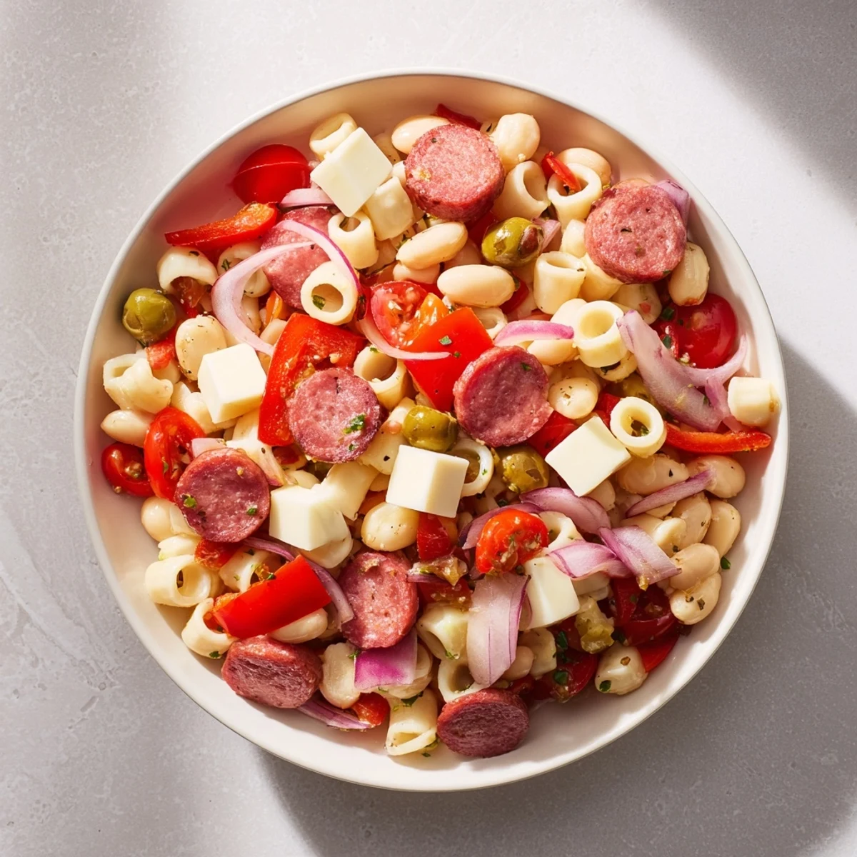 Vibrant Italian Antipasto Bean Salad with creamy beans, salami, and provolone, ready to serve and enjoy.