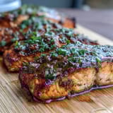Aromatic Cedar Plank Salmon with Lemon Dill, showcasing tender, flaky fillets infused with fresh herbs and zesty lemon.