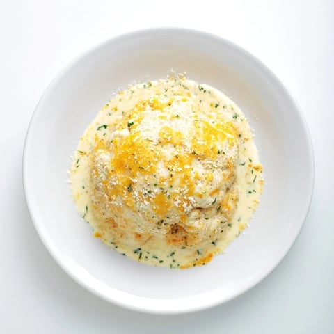 Golden-brown crust tops the bubbling Lightened Mac & Cheese Snowflake Pasta Bake with melted cheese.