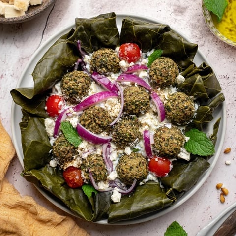 Festive Falafel & Tzatziki Christmas Wreath Wrap on a platter, ready for everyone to enjoy its flavors.