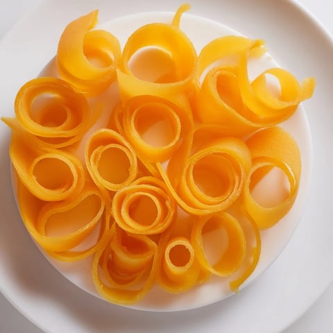 Cheesy Copper Coil appetizer: a vibrant spiral of sharp cheddar and sweet apricot, ready to enjoy.