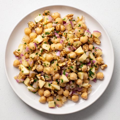 Fall Harvest Apple and Chickpea Salad: a colorful combination of apples, chickpeas, and walnuts, ready to enjoy.