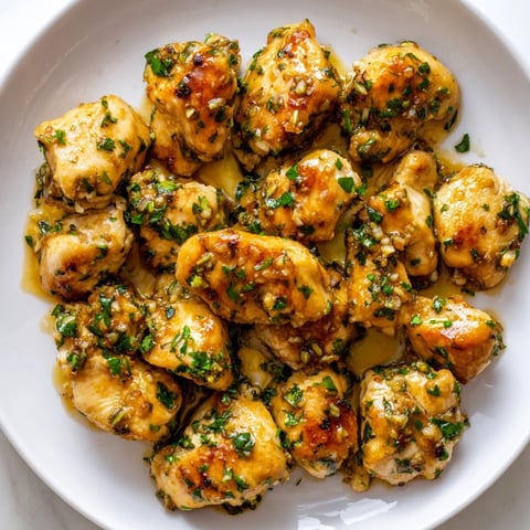 Golden, flavorful Garlic Butter Chicken Bites glistening in a butter sauce, perfect for dinner tonight.