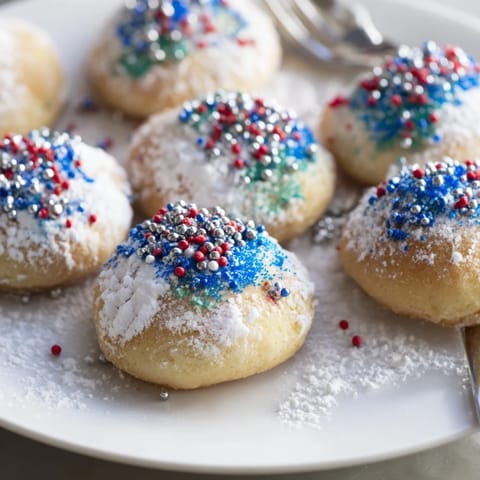 Colorful sprinkles adorn airy Festive Hanukkah Puffed Christmas Cookies that blend traditions beautifully.  