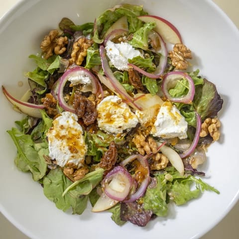 This Spiced Honey and Date Goat Cheese Salad features colorful ingredients and walnut crumbles, ready to eat alongside a light entrée.