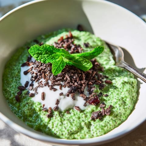 Cool, green Grinch Green Mint Matcha Chia Pudding, topped with cacao nibs and creamy yogurt, delicious breakfast.