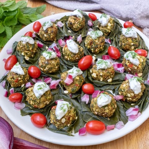 A beautiful, colorful image of a completed Festive Falafel Christmas Wreath, perfect for a holiday meal.