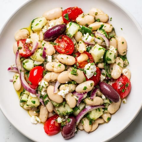 This refreshing white bean salad includes creamy beans and tastes of zesty Mediterranean flavors.