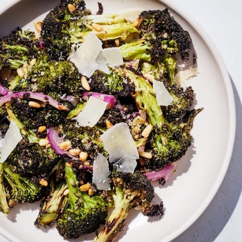Freshly made Charred Broccoli Salad tossed with Parmesan and herbs, ready to be enjoyed.