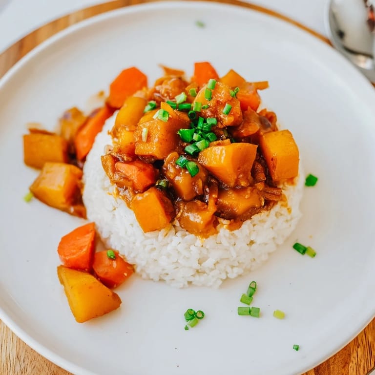 Aromatic Japanese Curry Pumpkin Twist showcases vibrant roasted pumpkin and colorful vegetables.  