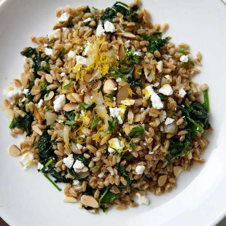 Close-up of a colorful, Mediterranean-inspired Farro & Greens Pilaf, perfect for a healthy dinner.