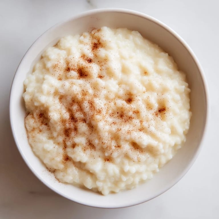 Warm, sweet Rice Pudding with Leftover Rice, perfectly flavored and delicious, great alone or with berries.