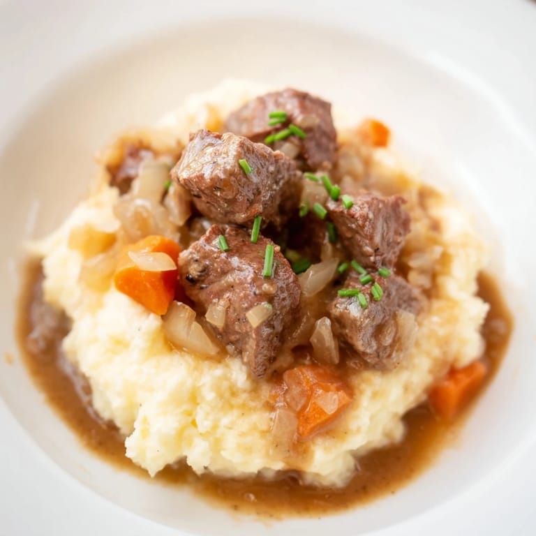 This Fall Apple Cider Stew Mash image shows aromatic beef stew with fluffy, cheesy mashed potatoes, perfect for fall.
