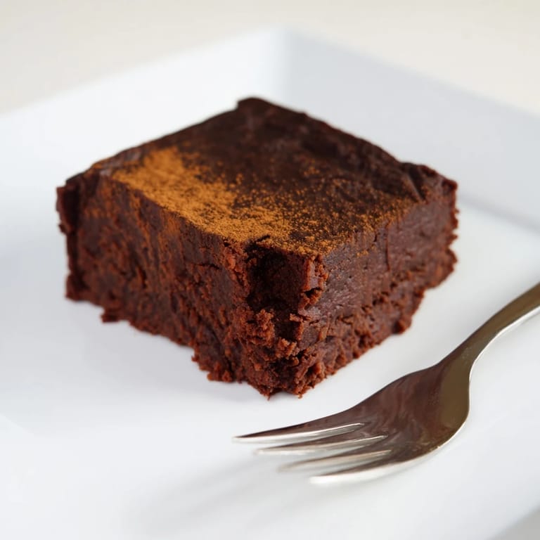 Nine squares of healthy Pumpkin Workout Brownies, deliciously gluten-free and ready for a post-workout snack.