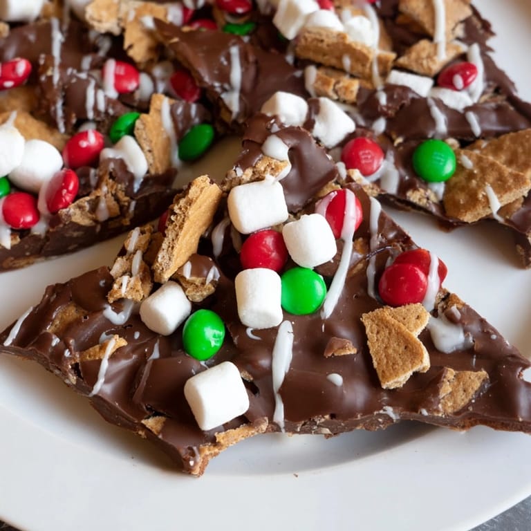 See layers of chocolate and toppings on this Quick Christmas Smores Bark, a delicious holiday dessert idea.