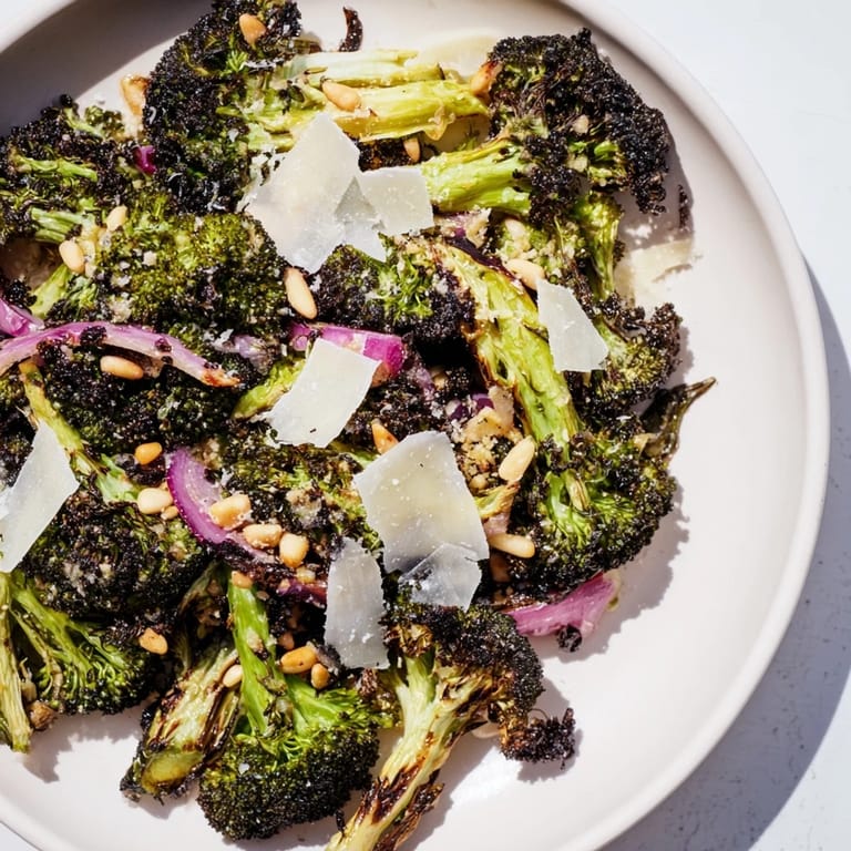 Freshly made Charred Broccoli Salad tossed with Parmesan and herbs, ready to be enjoyed.