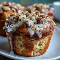 Bright, zesty lemon poppy seed muffins topped with a tangy lemon glaze, perfect for a cheerful spring brunch spread.